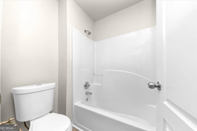 bathroom with shower / bath combination and toilet