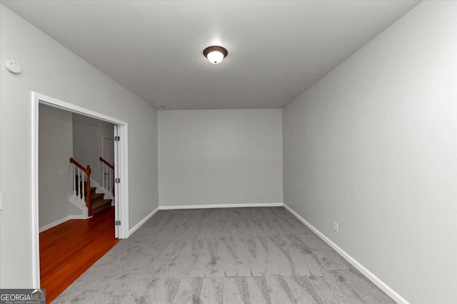 empty room featuring light colored carpet