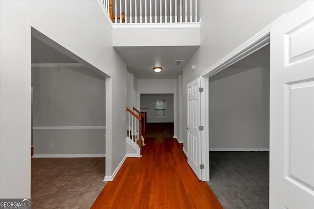 hall with dark wood-type flooring