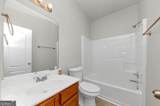 full bathroom featuring toilet, vanity, and shower / washtub combination