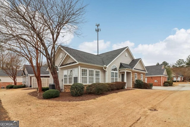 ranch-style home with cooling unit