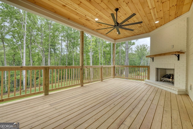 wooden terrace with a ceiling fan