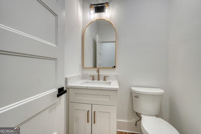 half bath with toilet and vanity