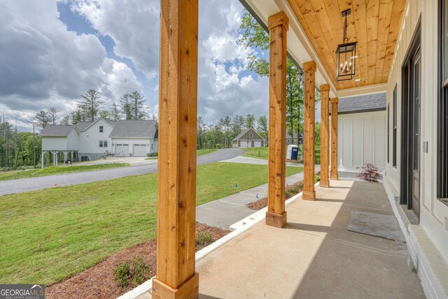 view of patio with covered porch and a residential view