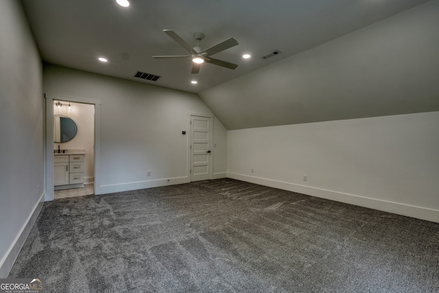 additional living space with visible vents, a ceiling fan, baseboards, and carpet floors