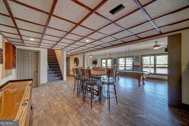 dining room with hardwood / wood-style floors, baseboards, stairway, recessed lighting, and pool table