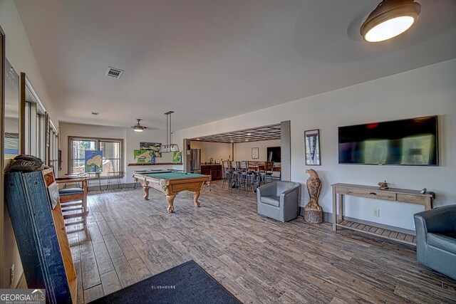 rec room with billiards, ceiling fan, wood finished floors, and visible vents