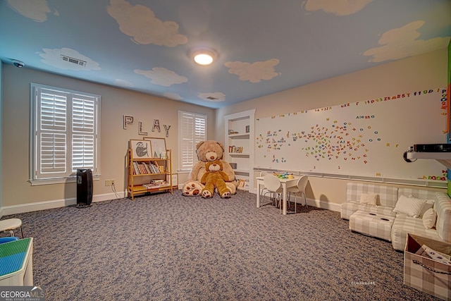 recreation room featuring baseboards, carpet, and visible vents