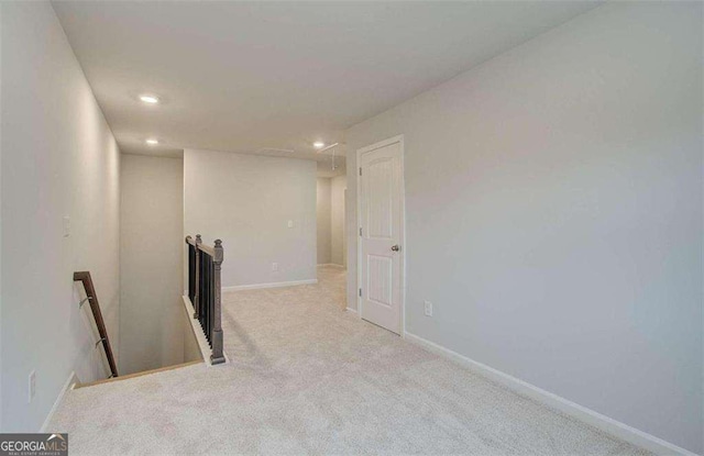 spare room with light colored carpet