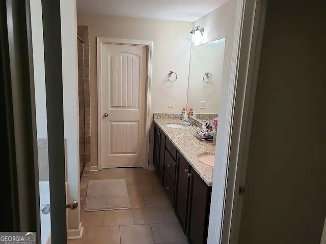 bathroom featuring tile patterned floors and vanity