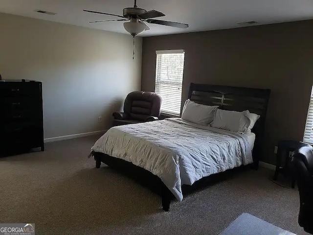 bedroom with ceiling fan and carpet flooring