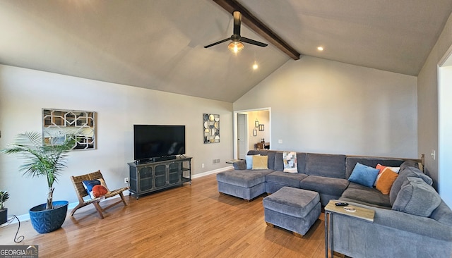 living room with ceiling fan, wood-type flooring, beam ceiling, and high vaulted ceiling