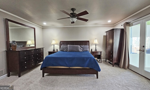 carpeted bedroom with ornamental molding, french doors, and ceiling fan