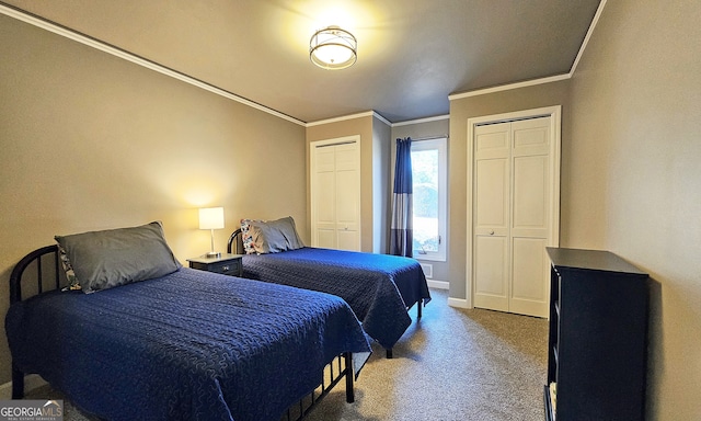 carpeted bedroom featuring crown molding and multiple closets