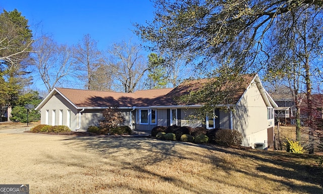 single story home featuring central AC and a front yard