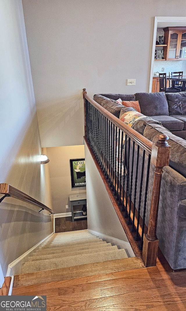 staircase featuring hardwood / wood-style flooring