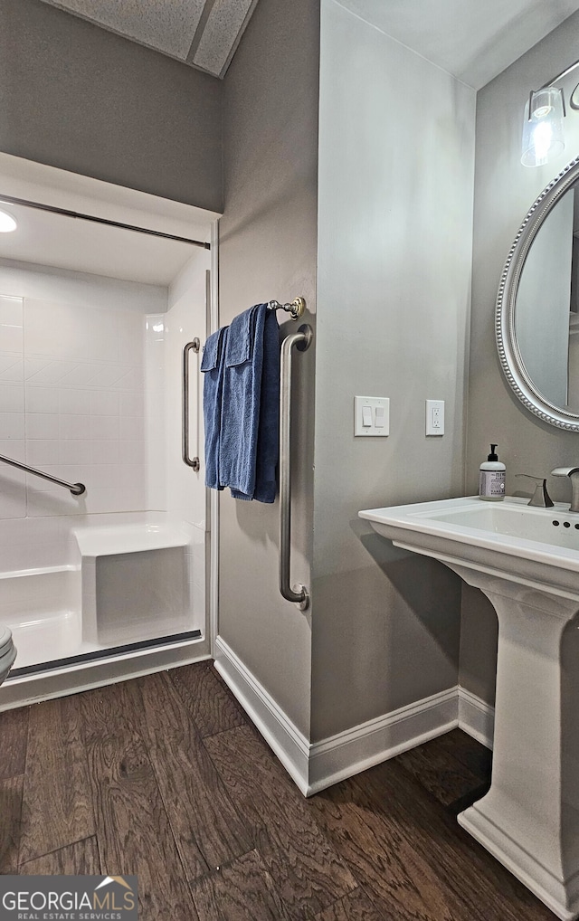 bathroom featuring a tub to relax in and wood-type flooring