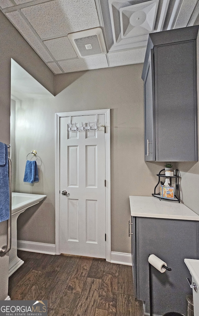 laundry area featuring dark hardwood / wood-style flooring