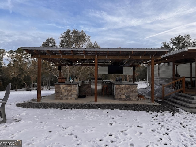 exterior space with a bar and grilling area