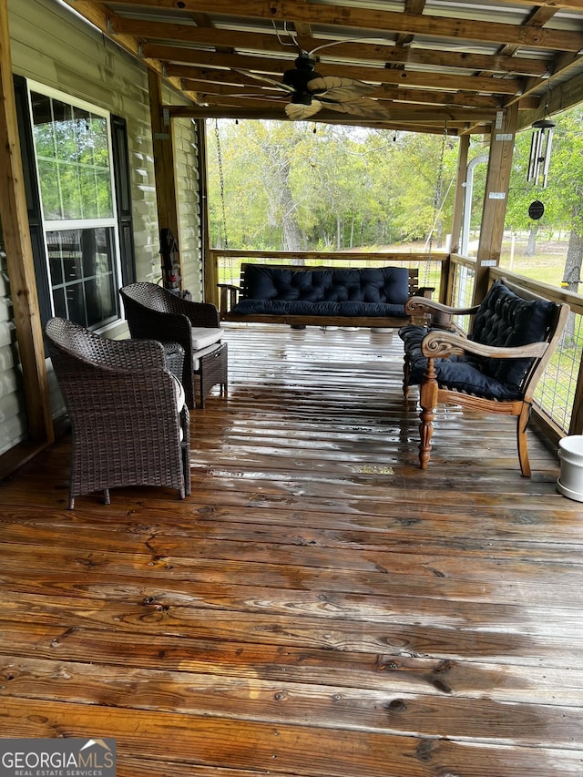 deck featuring a porch and ceiling fan