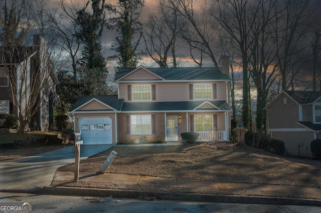 front facade featuring a garage and a porch