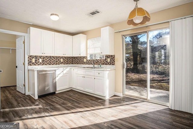 kitchen with white cabinetry, dishwasher, plenty of natural light, and decorative light fixtures