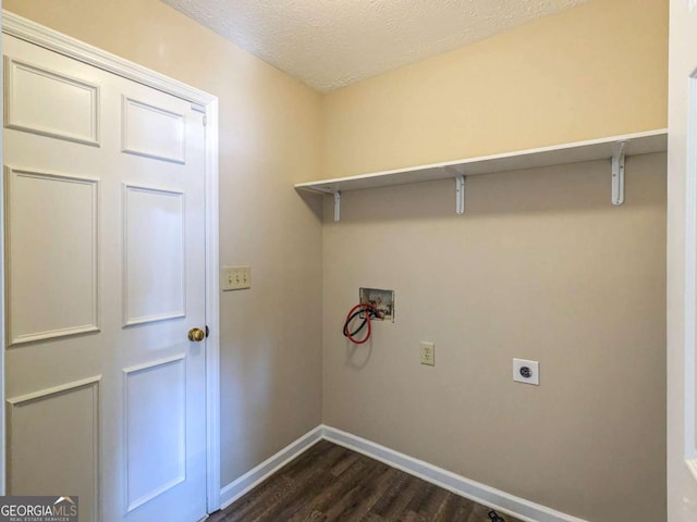 laundry room with dark hardwood / wood-style flooring, hookup for a washing machine, a textured ceiling, and electric dryer hookup