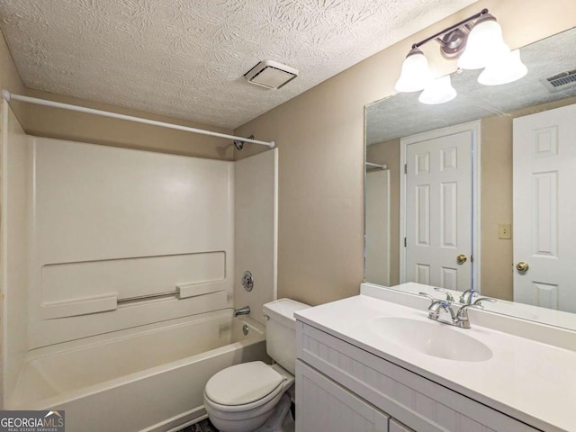 full bathroom with vanity, a textured ceiling, bathtub / shower combination, and toilet