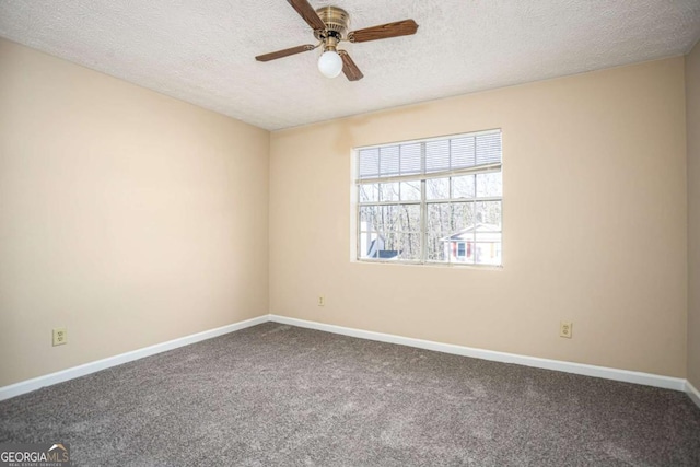 unfurnished room featuring ceiling fan, carpet flooring, and a textured ceiling