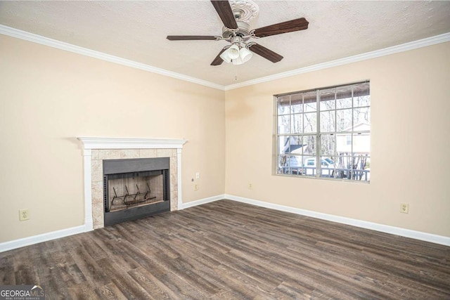 unfurnished living room with crown molding, a fireplace, dark hardwood / wood-style floors, and a textured ceiling