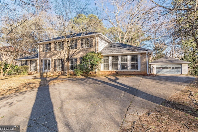 view of front of house featuring a garage and an outdoor structure