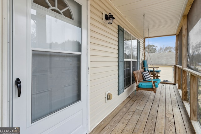 wooden terrace featuring a porch