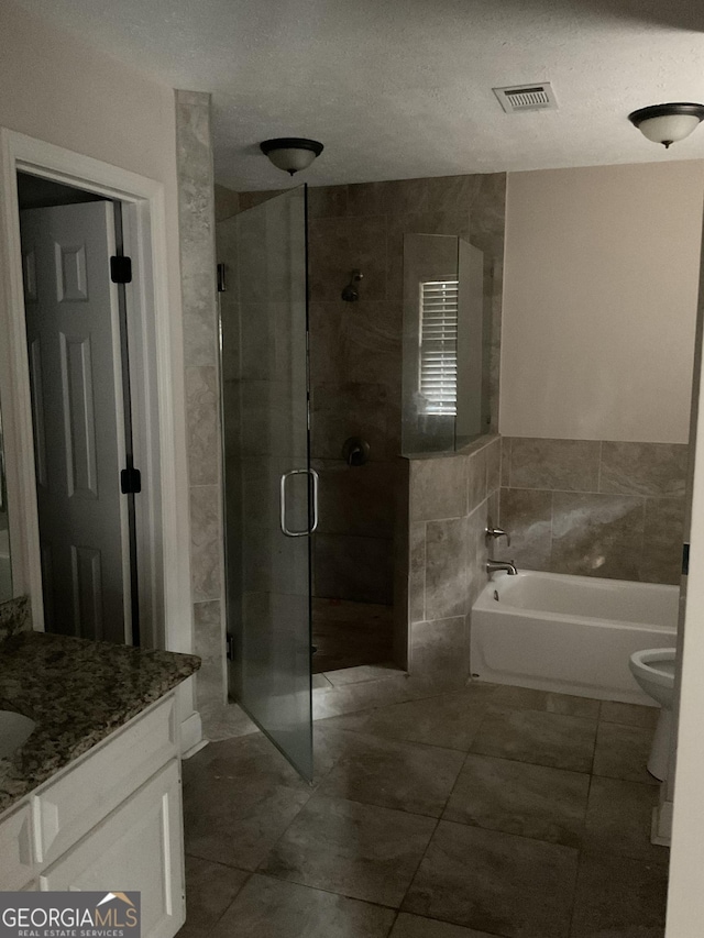 full bathroom with vanity, tile walls, independent shower and bath, and toilet