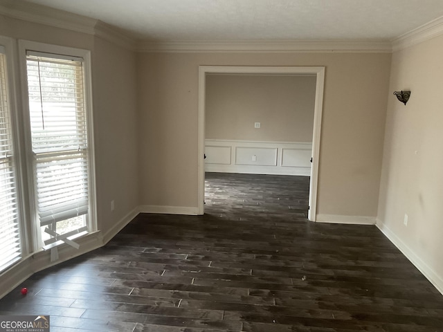 unfurnished room featuring dark hardwood / wood-style flooring and crown molding