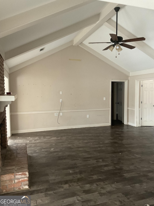 unfurnished living room with dark hardwood / wood-style flooring, a fireplace, lofted ceiling with beams, and ceiling fan