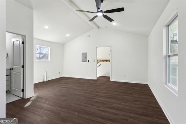 interior space with dark hardwood / wood-style flooring, vaulted ceiling with beams, plenty of natural light, and electric panel