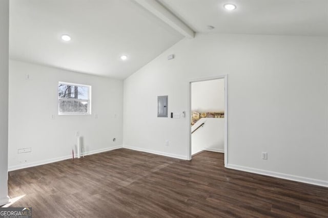 empty room with vaulted ceiling with beams, dark wood-type flooring, and electric panel