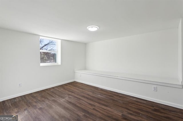 empty room featuring dark hardwood / wood-style flooring