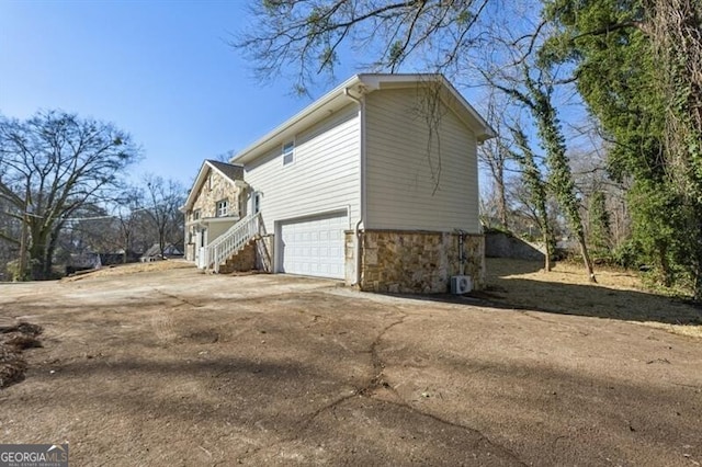 view of side of property featuring a garage