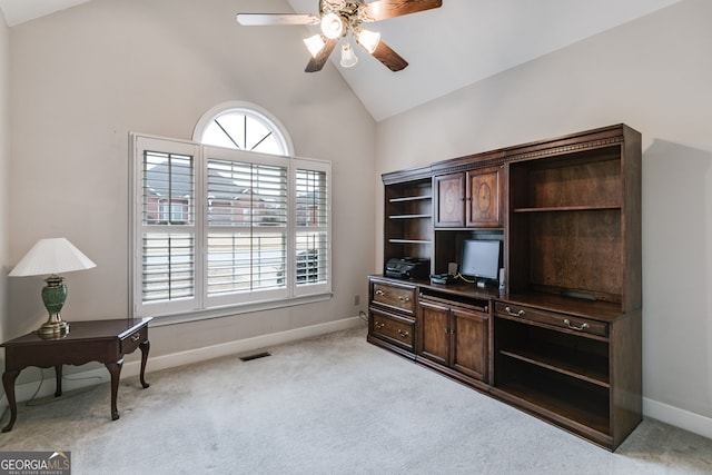 carpeted office space featuring ceiling fan, high vaulted ceiling, and plenty of natural light