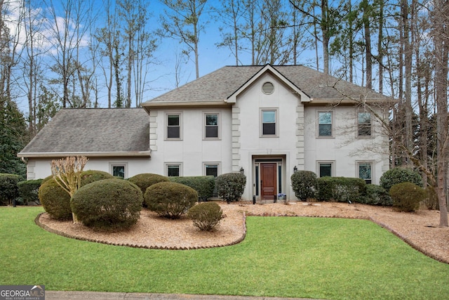 view of front of home with a front lawn