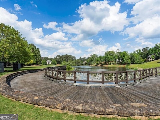 view of home's community with a water view