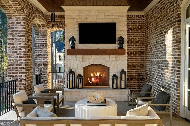 view of patio / terrace featuring an outdoor living space with a fireplace