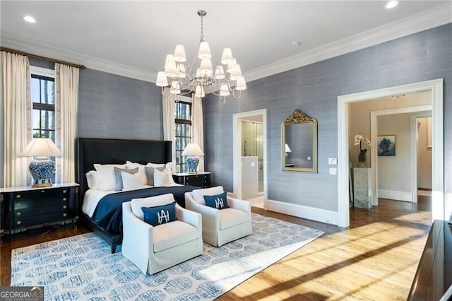 bedroom featuring a notable chandelier, hardwood / wood-style flooring, and ornamental molding