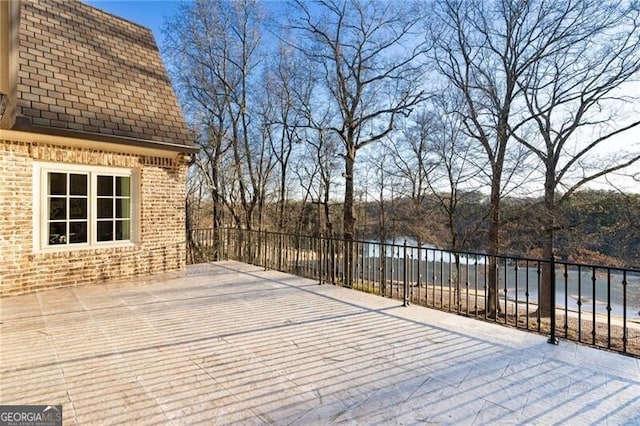 deck featuring a water view