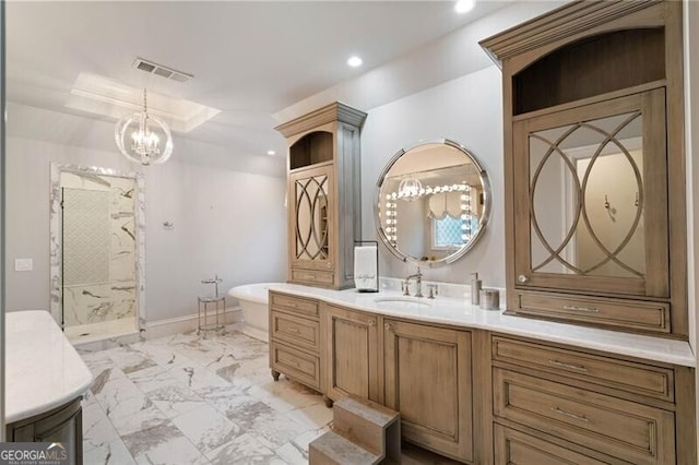 bathroom with vanity, independent shower and bath, and a notable chandelier