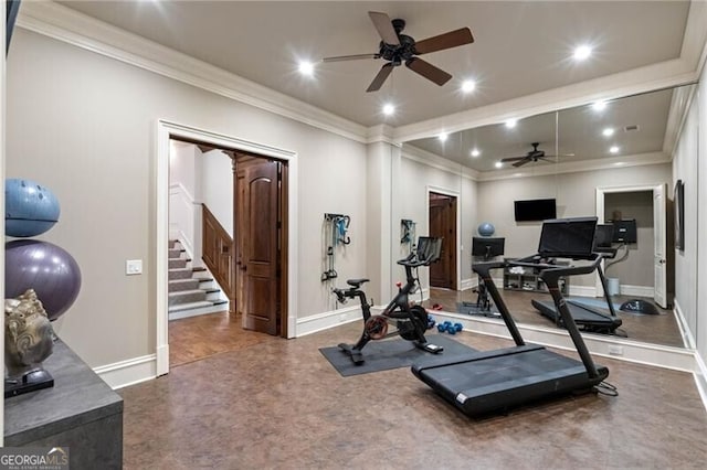 workout room featuring ceiling fan and ornamental molding