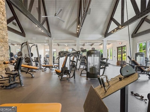 exercise room featuring ceiling fan, high vaulted ceiling, and decorative columns