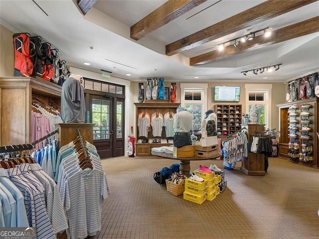 interior space featuring beam ceiling and carpet