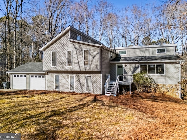 view of front of property with a garage and a front yard